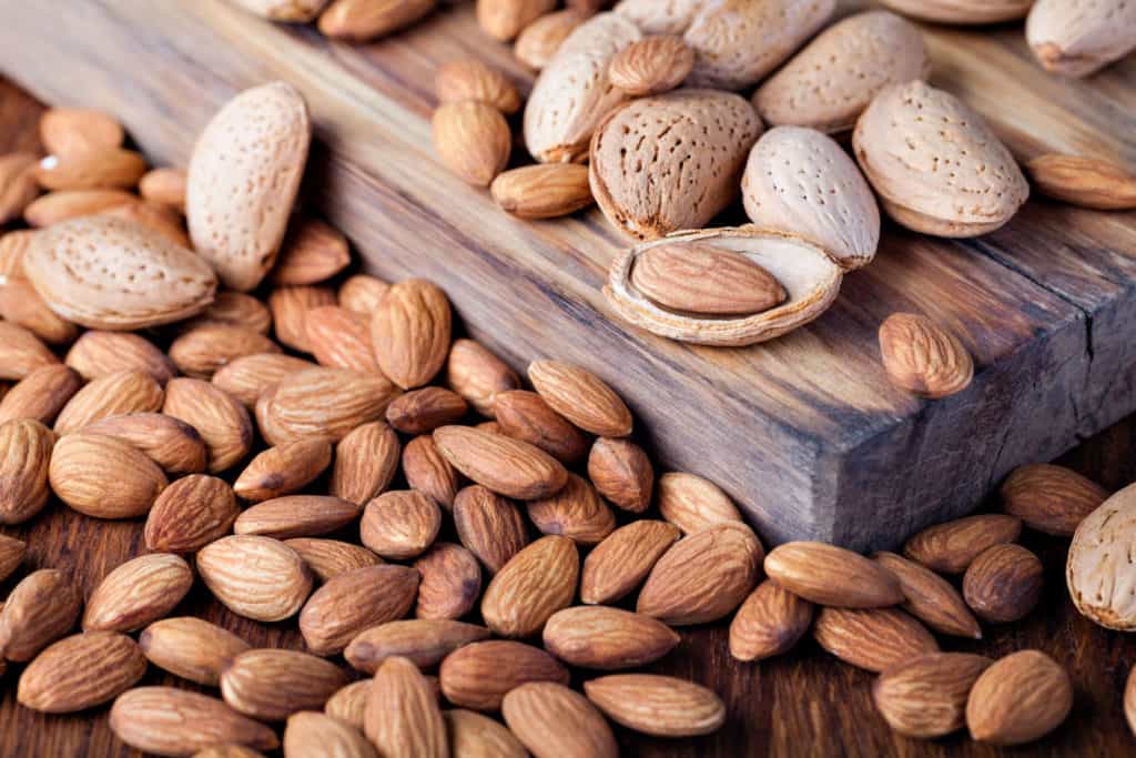 almonds nuts on a wooden table