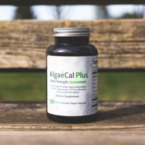 AlgaeCal Plus bottle on a bench