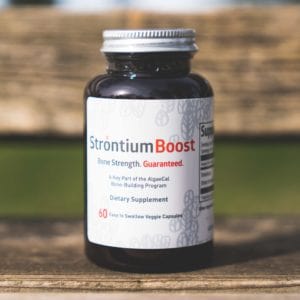 Strontium Boost bottle on a bench