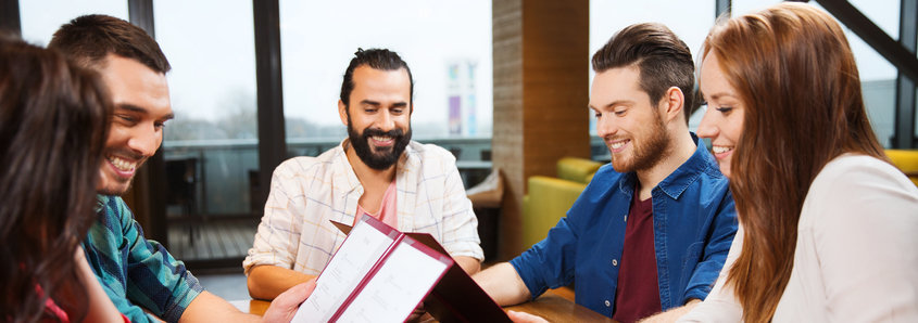 People looking at menu in restaurant