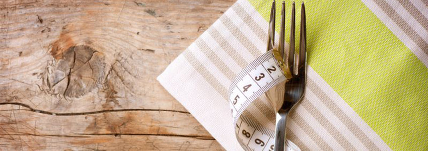 Fork and measuring tape on a napkin