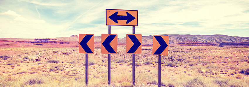 Signs pointing in different directions